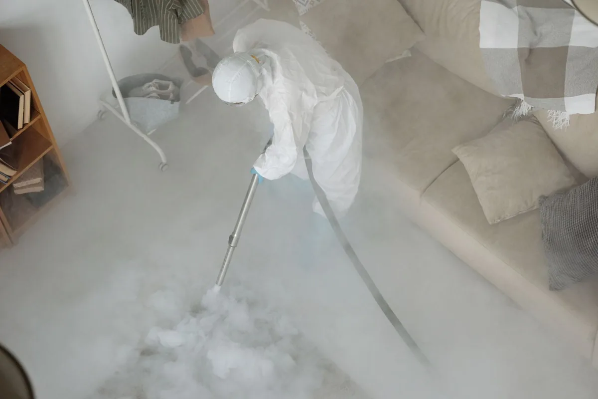 Biohazard cleanup technician in protective equipment, Sheboygan Falls, WI